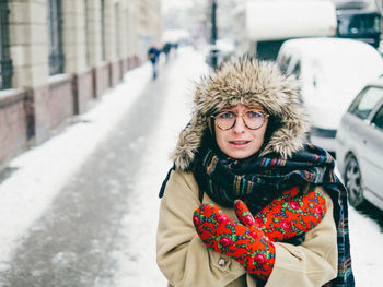 Portrait of young woman feeling cold during winter