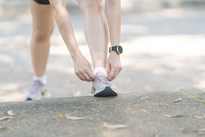 Low section of woman walking outdoors