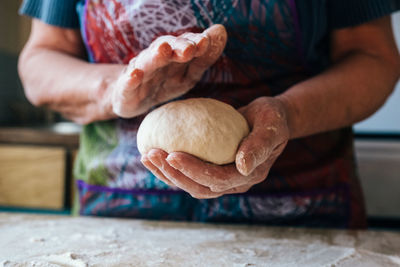 Close-up of person preparing food