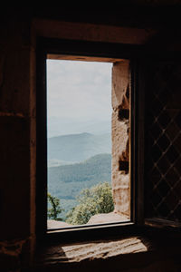 Scenic view of mountains seen through window