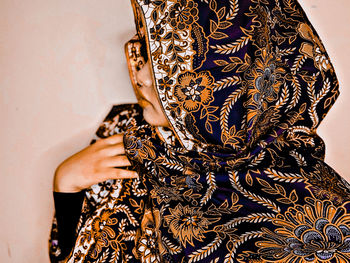 Modern woman wearing batik as scarf