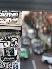 Close-up of information sign in city