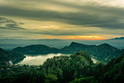 Scenic view of lake against sky during sunset