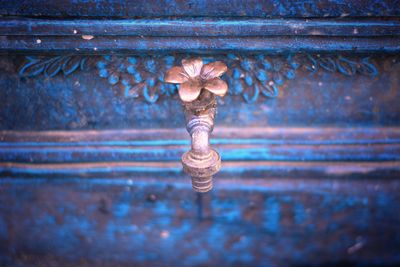 Close-up of rusty metal against wall