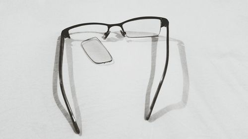 Close-up of sunglasses against white background