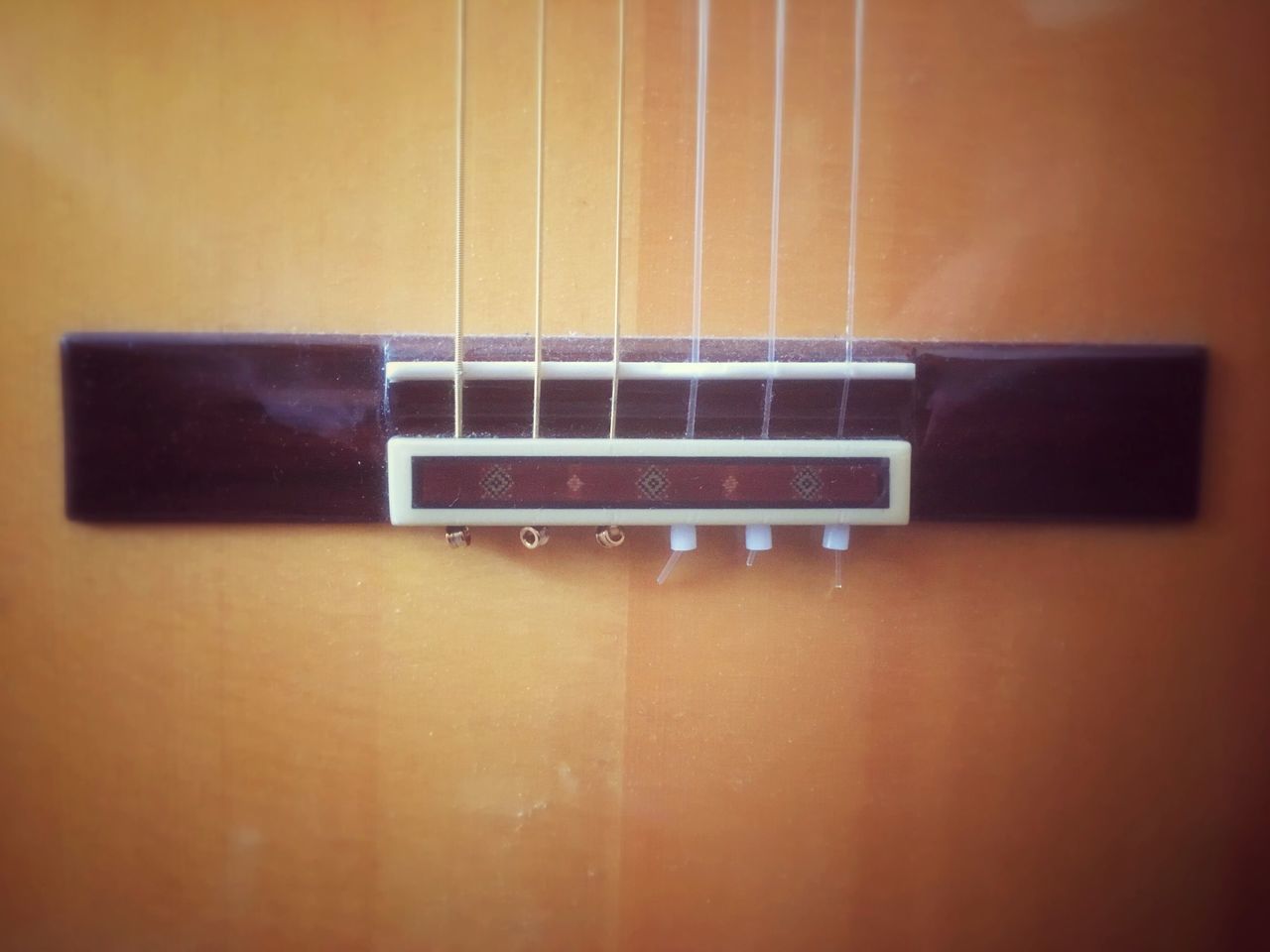 CLOSE-UP OF GUITAR IN BATHROOM