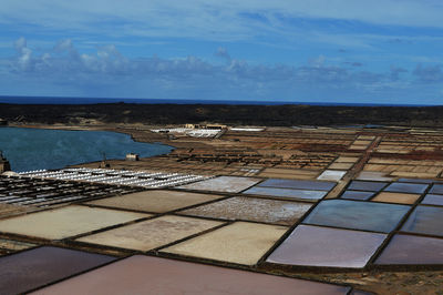 High angle view of salt flat by sea