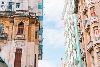 Low angle view of buildings in city against sky