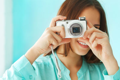 Portrait of woman photographing