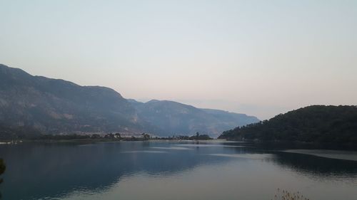 Scenic view of lake against sky during sunset