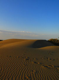 Scenic view of desert against clear sky