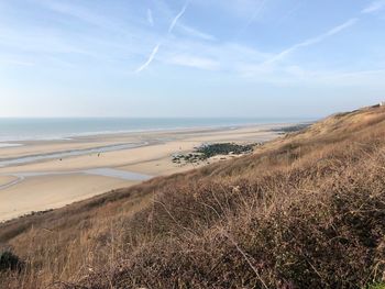 Scenic view of beach against sky