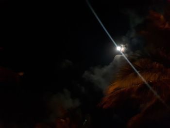 Low angle view of illuminated street light at night