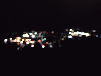 Defocused image of illuminated lights at night