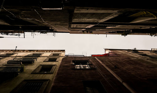 Low angle view of buildings in city against sky