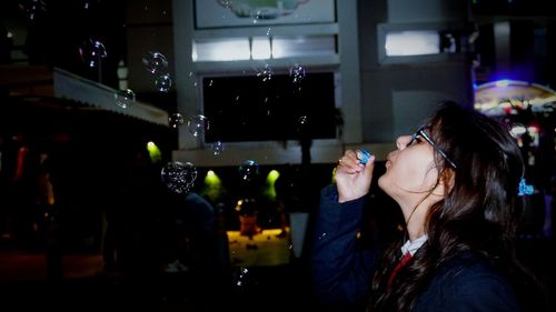 Portrait of young woman drinking glass