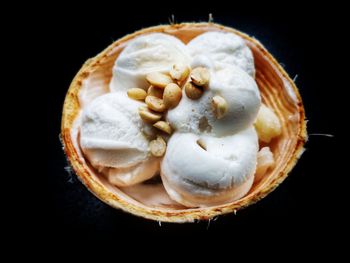 Directly above shot of ice cream over black background