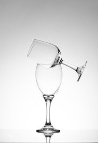 Close-up of wineglass against white background