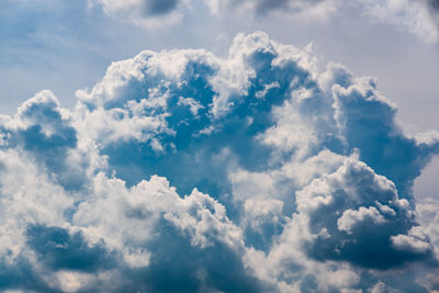 Blue sky with cumulus clouds during summer day background