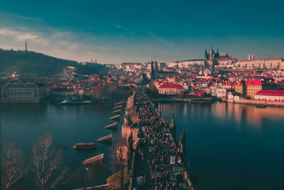 High angle view of river and townscape against sky