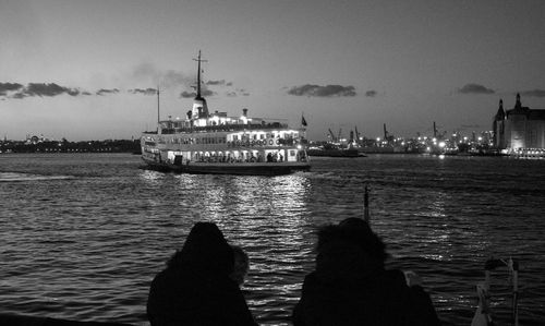Silhouette people in boat