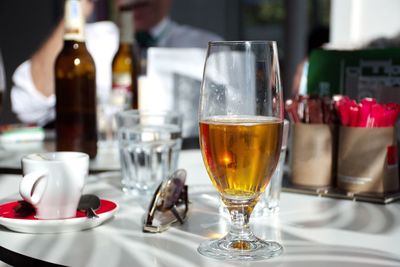 Close-up of wine glasses on table