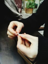 Close-up of hands holding jewelry