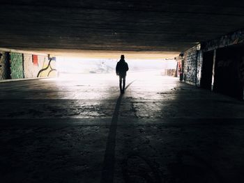 Full length of woman walking on road