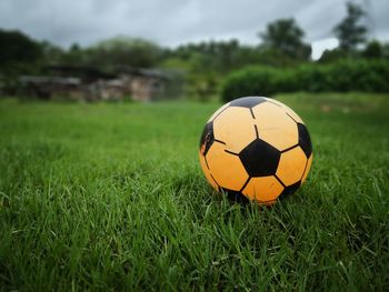 Close-up of soccer ball on field