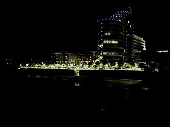 Buildings in city at night