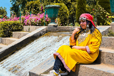 Young woman sitting on staircase