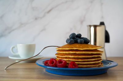 Close-up of breakfast served on table