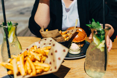 Close-up of person preparing food on cutting board