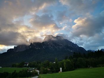 Scenic view of landscape and mountains against sky