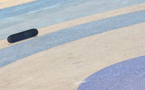 High angle view of skateboard on road