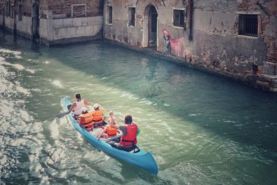 High angle view of people on canal