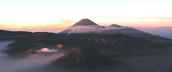 View of volcanic mountain during sunset