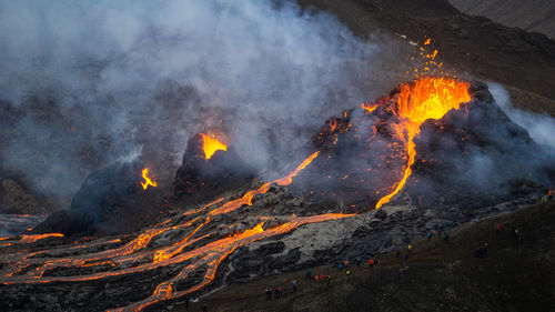 Smoke emitting from volcanic mountain at night