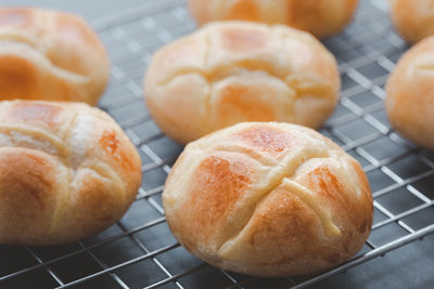 High angle view of bread on metal grate