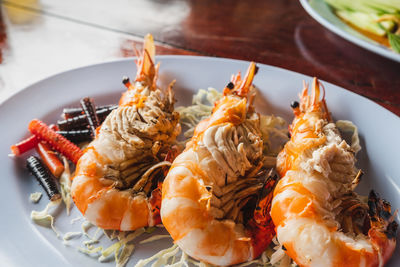 High angle view of prawns in plate on table