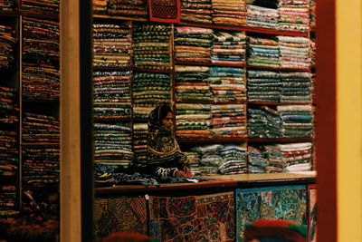 Woman selling textiles at store