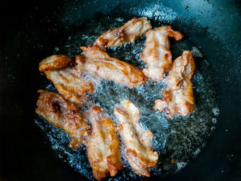 High angle view of meat on barbecue grill