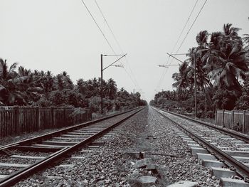 Railroad tracks against clear sky