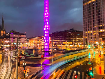 High angle view of light trails on road at night