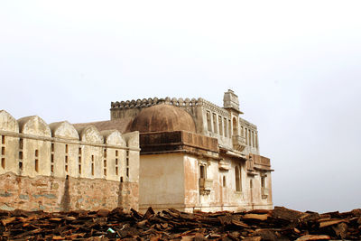 Low angle view of old building against clear sky