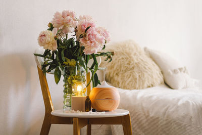 Aroma oil diffuser on chair against in the bedroom. air freshener.