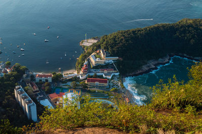 High angle view of townscape by sea