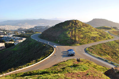 High angle view of winding road on mountain against sky