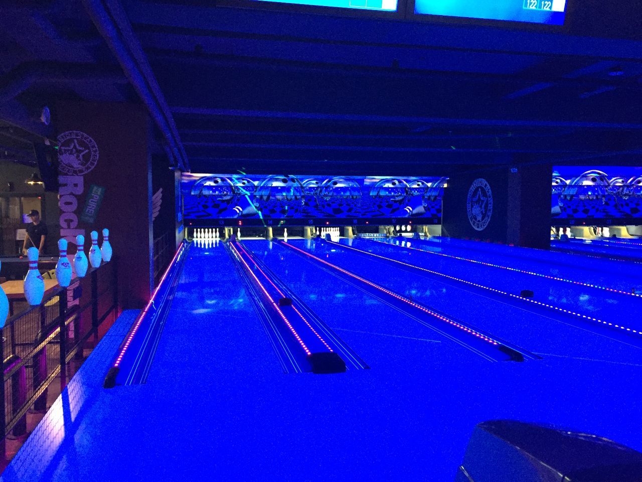 sports, bowling, ball game, individual sports, architecture, team sport, illuminated, blue, transportation, built structure, night, indoors, bowling pin, bowling equipment, no people