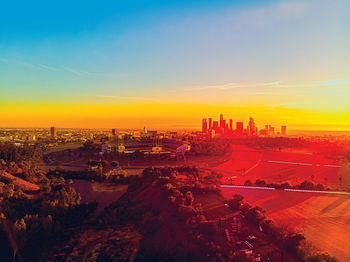 High angle view of buildings against sky during sunset